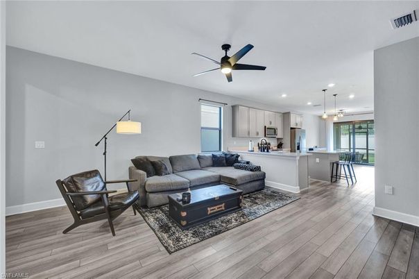 Dining room, Interior, Kitchen, Living room, Pendant Lights, Recessed Lighting, Stainless Steel Appliances, Wood Texture Flooring