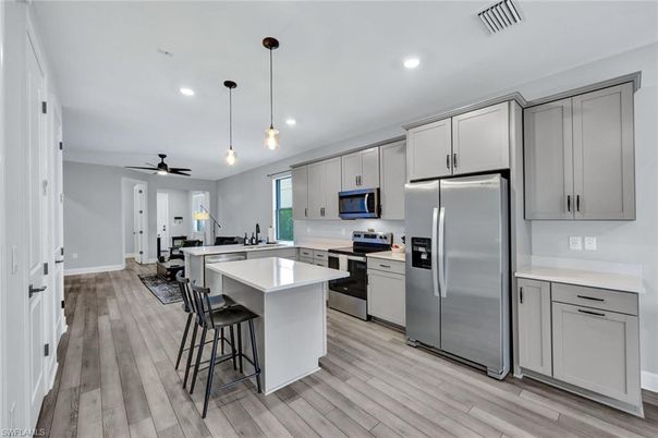 Interior, Kitchen, Pendant Lights, Recessed Lighting, Stainless Steel Appliances, Wood Texture Flooring
