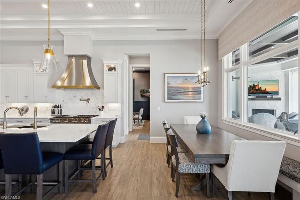 Dining room, Interior, Kitchen, Pendant Lights, Recessed Lighting, Stainless Steel Appliances, Wood Texture Flooring