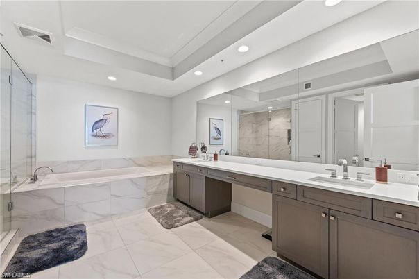 Bathroom, Dual Sink Vanities, Glass Shower, Interior, Marble, Marble Walls, Recessed Lighting