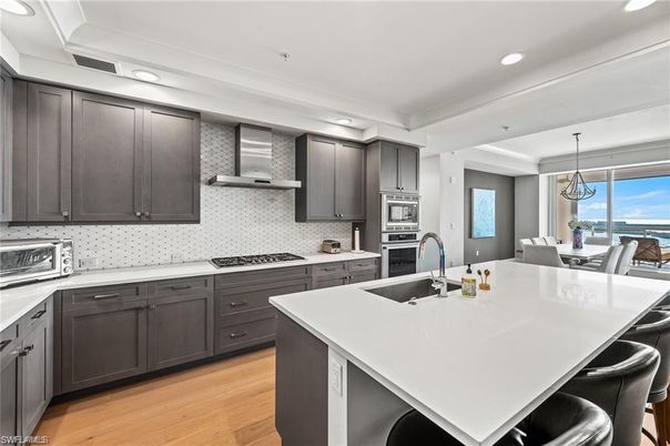 Dining room, Interior, Kitchen, Pendant Lights, Recessed Lighting, Stainless Steel Appliances, Water, Wood Texture Flooring