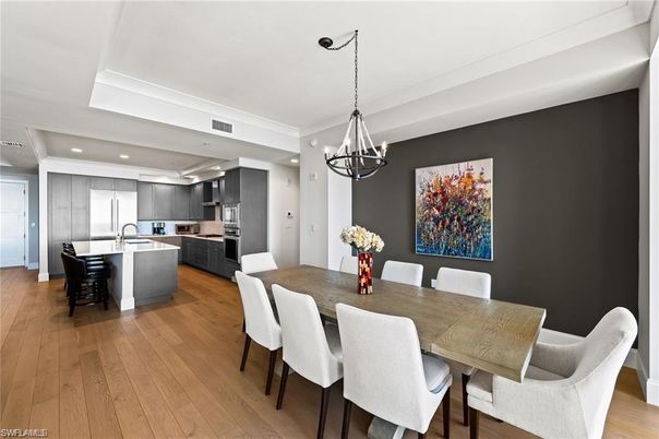 Chandelier, Dining room, Interior, Kitchen, Pendant Lights, Recessed Lighting, Stainless Steel Appliances, Wood Texture Flooring