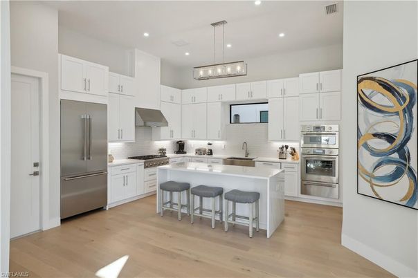 Interior, Kitchen, Pendant Lights, Recessed Lighting, Stainless Steel Appliances, Wood Texture Flooring