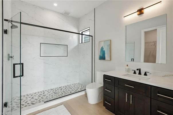 Bathroom, Glass Shower, Interior, Marble Walls, Recessed Lighting, Wood Texture Flooring