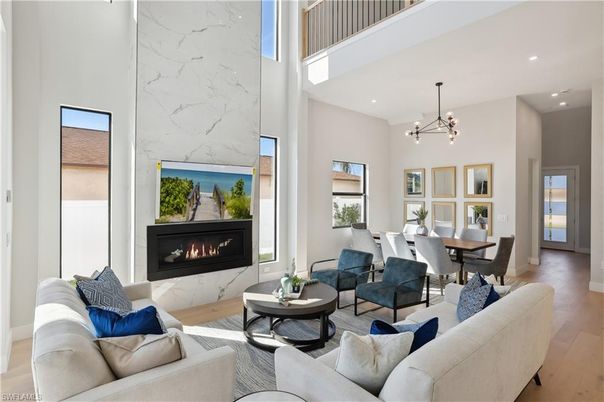 Dining room, Fireplace, Interior, Living room, Marble Walls, Pendant Lights, Recessed Lighting, Wood Texture Flooring