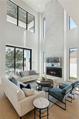 Fireplace, Interior, Living room, Marble Walls, Recessed Lighting, Wood Texture Flooring