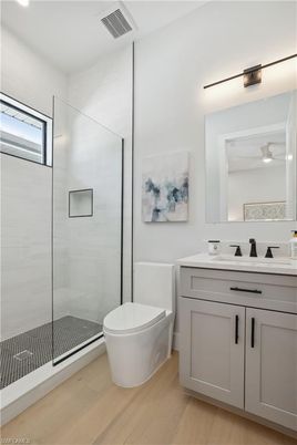 Bathroom, Glass Shower, Interior, Recessed Lighting, Wood Texture Flooring