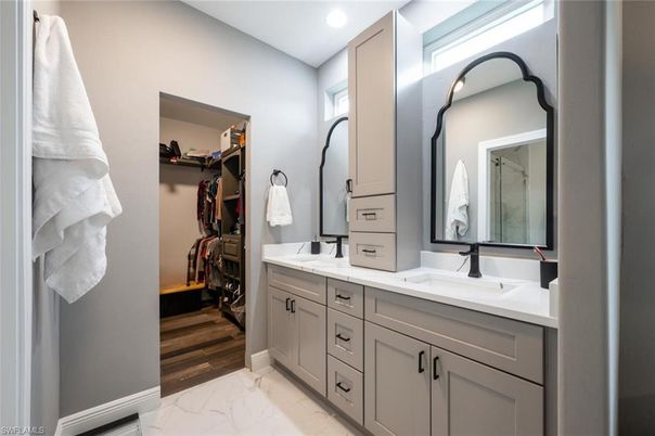 Bathroom, Dual Sink Vanities, Interior, Marble, Recessed Lighting, Walk-in Closets, Wood Texture Flooring