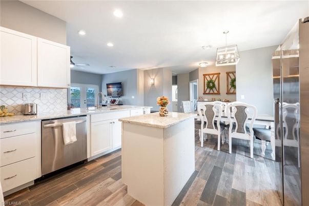 Dining room, Interior, Kitchen, Recessed Lighting, Stainless Steel Appliances, Wood Texture Flooring