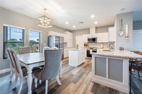 Dining room, Interior, Kitchen, Recessed Lighting, Stainless Steel Appliances, Wood Texture Flooring