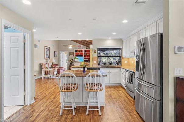 Dining room, Interior, Kitchen, Pendant Lights, Recessed Lighting, Stainless Steel Appliances, Wooden Beams, Wood Texture Flooring