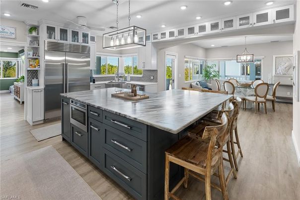 Dining room, Interior, Kitchen, Pendant Lights, Recessed Lighting, Stainless Steel Appliances, Wood Texture Flooring