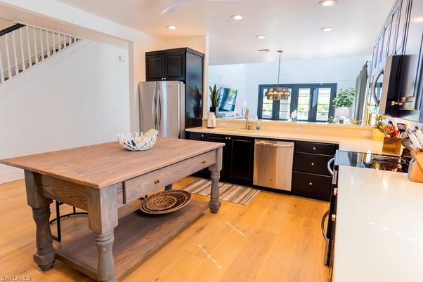 Chandelier, Interior, Kitchen, Pendant Lights, Recessed Lighting, Stainless Steel Appliances, Wood Texture Flooring