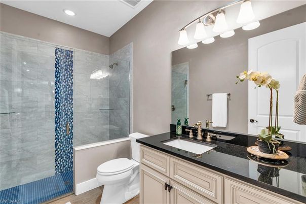 Bathroom, Dual Sink Vanities, Glass Shower, Interior, Recessed Lighting, Wood Texture Flooring