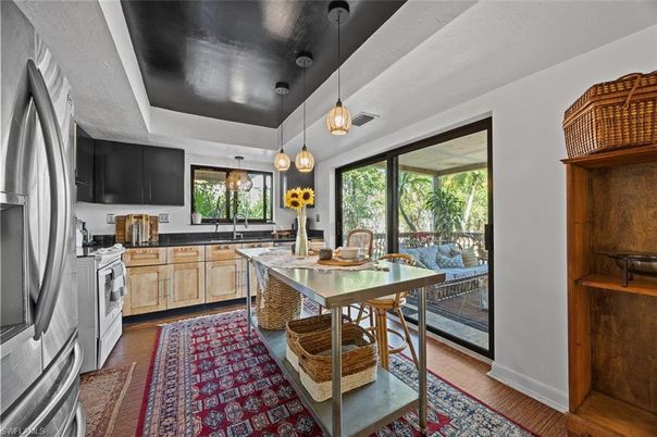 Dining room, Interior, Kitchen, Pendant Lights, Stainless Steel Appliances, Wood Texture Flooring