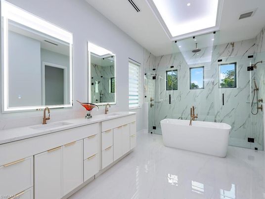Bathroom, Dual Sink Vanities, Free Standing Baths, Glass Shower, Interior, Marble, Marble Walls, Recessed Lighting
