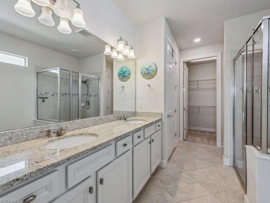 Bathroom, Dual Sink Vanities, Glass Shower, Interior, Recessed Lighting, Walk-in Closets