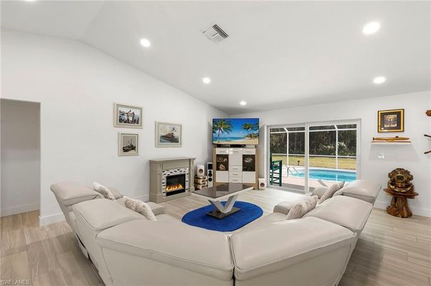 Fireplace, Interior, Living room, Recessed Lighting, Wood Texture Flooring