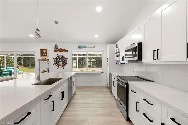 Interior, Kitchen, Pendant Lights, Recessed Lighting, Stainless Steel Appliances, Wood Texture Flooring