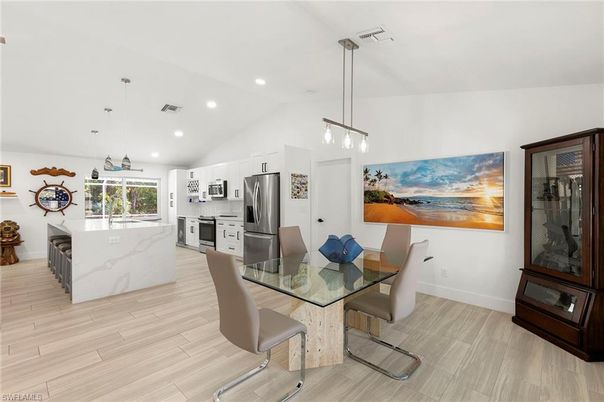 Dining room, Interior, Kitchen, Pendant Lights, Recessed Lighting, Stainless Steel Appliances, Wood Texture Flooring
