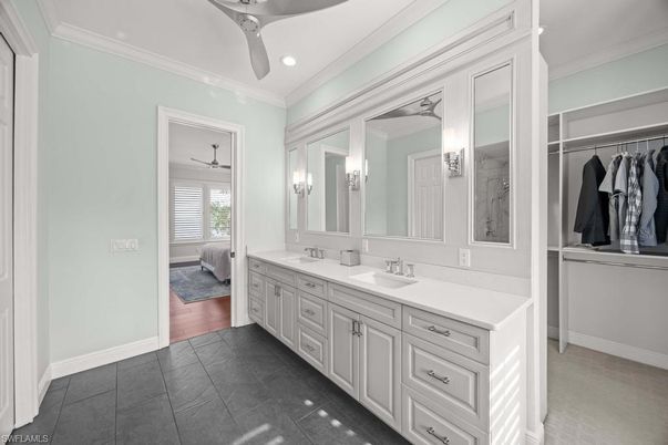 Bathroom, Dual Sink Vanities, Interior, Recessed Lighting, Walk-in Closets, Wood Texture Flooring
