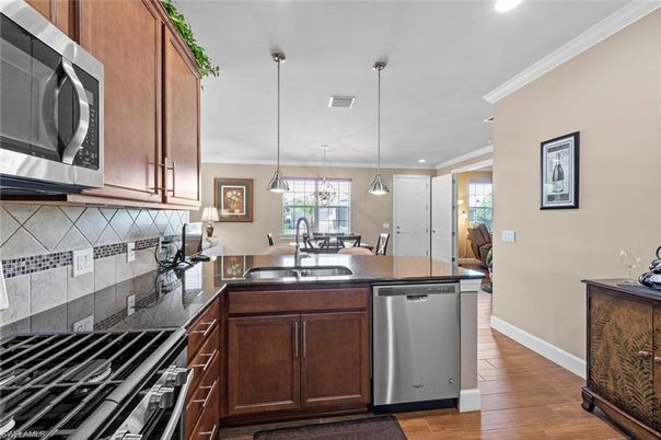 Dining room, Interior, Kitchen, Pendant Lights, Recessed Lighting, Stainless Steel Appliances, Wood Texture Flooring