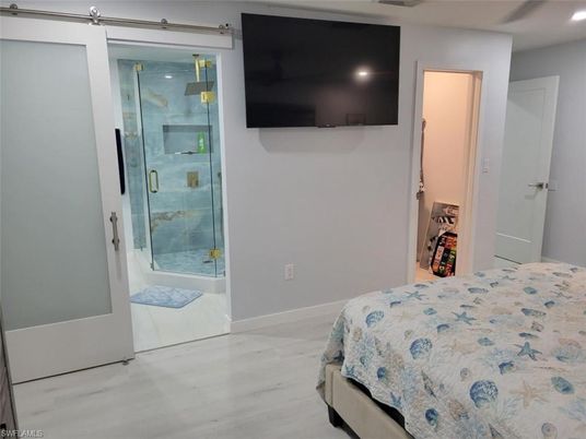 Bathroom, Bedroom, Glass Shower, Interior, Recessed Lighting, Wood Texture Flooring