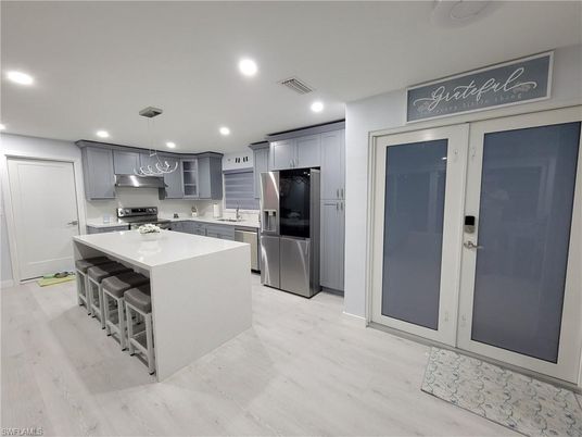 Interior, Kitchen, Pendant Lights, Recessed Lighting, Stainless Steel Appliances, Wood Texture Flooring