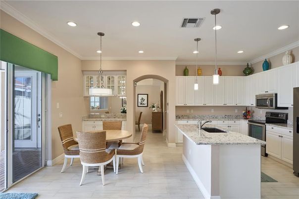 Dining room, Interior, Kitchen, Pendant Lights, Recessed Lighting, Stainless Steel Appliances, Wood Texture Flooring