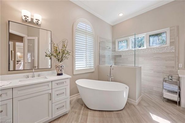 Bathroom, Dual Sink Vanities, Free Standing Baths, Glass Shower, Interior, Recessed Lighting, Wood Texture Flooring