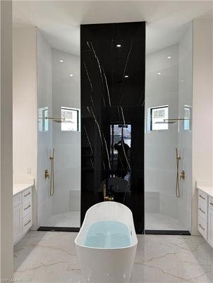 Bathroom, Free Standing Baths, Glass Shower, Interior, Marble, Marble Walls, Recessed Lighting