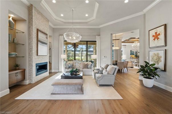 Chandelier, Dining room, Fireplace, Interior, Living room, Pendant Lights, Recessed Lighting, Wood Texture Flooring