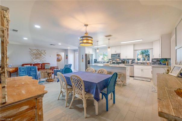 Dining room, Interior, Kitchen, Living room, Pendant Lights, Recessed Lighting, Stainless Steel Appliances, Wood Texture Flooring