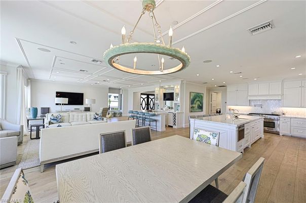 Chandelier, Dining room, Interior, Kitchen, Living room, Pendant Lights, Recessed Lighting, Stainless Steel Appliances, Wood Texture Flooring
