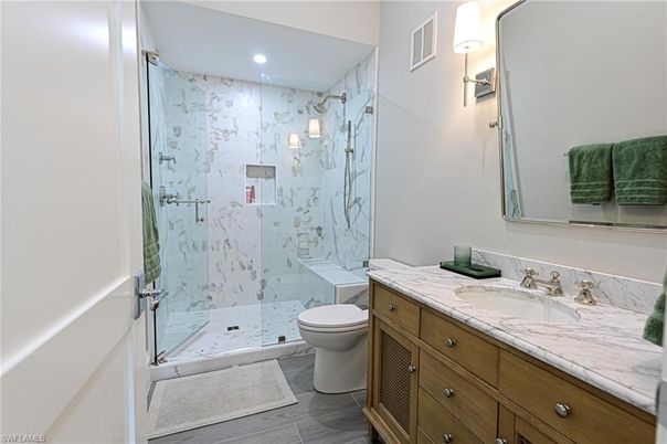 Bathroom, Glass Shower, Interior, Marble, Marble Walls, Recessed Lighting, Wood Texture Flooring