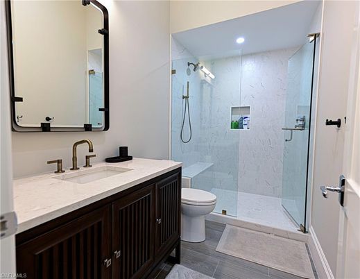 Bathroom, Glass Shower, Interior, Marble Walls, Recessed Lighting, Wood Texture Flooring