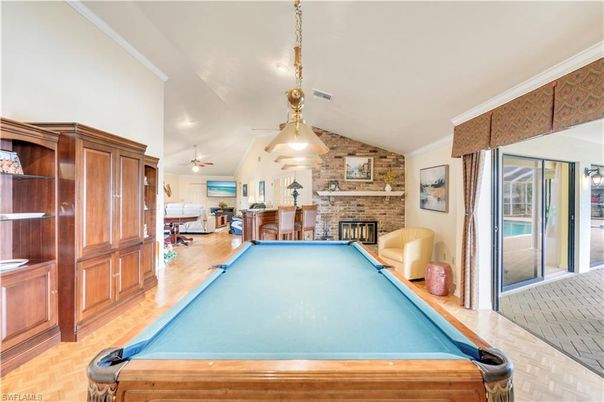 Billiard Table, Fireplace, Game Room, Interior, Pendant Lights, Stone Walls, Wood Texture Flooring