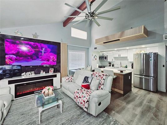 Fireplace, Interior, Kitchen, Living room, Recessed Lighting, Stainless Steel Appliances, Wood Texture Flooring