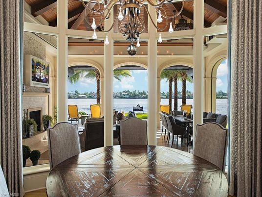 Chandelier, Dining room, Fireplace, Interior, Water, Wooden Beams, Wooden Ceilings, Wood Texture Flooring