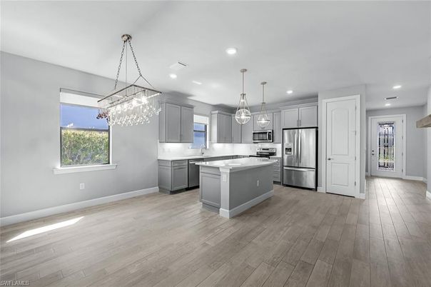 Chandelier, Interior, Kitchen, Pendant Lights, Recessed Lighting, Stainless Steel Appliances, Wood Texture Flooring