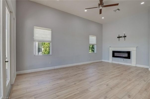 Empty room, Fireplace, Interior, Recessed Lighting, Wood Texture Flooring