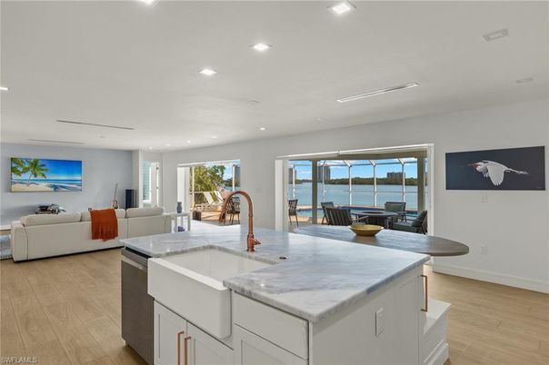 Dining room, Interior, Kitchen, Living room, Recessed Lighting, Water, Wood Texture Flooring