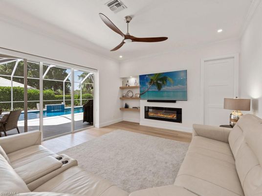 Fireplace, Interior, Living room, Recessed Lighting, Sun Room, Wood Texture Flooring