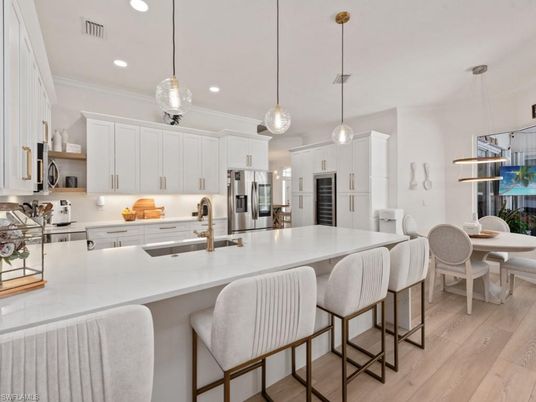Dining room, Interior, Kitchen, Pendant Lights, Recessed Lighting, Stainless Steel Appliances, Wood Texture Flooring