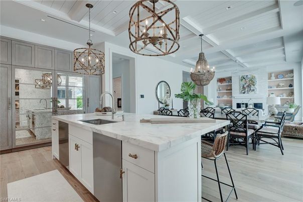 Chandelier, Dining room, Interior, Kitchen, Living room, Pendant Lights, Stainless Steel Appliances, Wood Texture Flooring