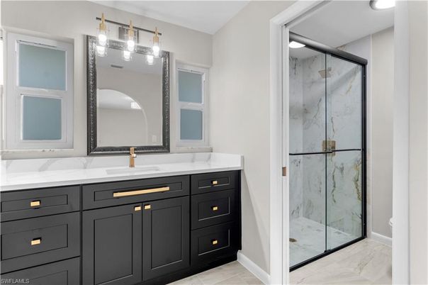Bathroom, Dual Sink Vanities, Glass Shower, Interior, Marble, Marble Walls, Recessed Lighting