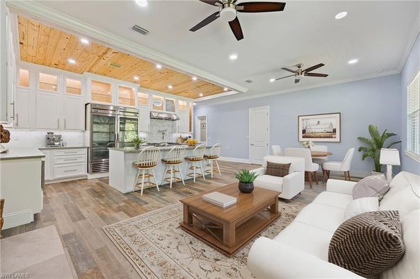 Dining room, Interior, Kitchen, Living room, Recessed Lighting, Stainless Steel Appliances, Wooden Ceilings, Wood Texture Flooring