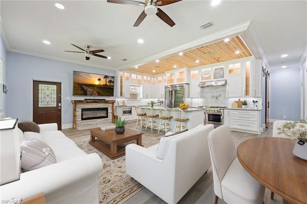 Fireplace, Interior, Kitchen, Living room, Recessed Lighting, Stainless Steel Appliances, Wooden Ceilings, Wood Texture Flooring