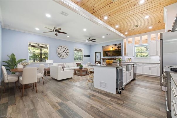 Dining room, Interior, Kitchen, Living room, Recessed Lighting, Stainless Steel Appliances, Wooden Ceilings, Wood Texture Flooring