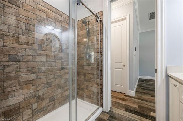 Bathroom, Glass Shower, Interior, Stone Walls, Wood Texture Flooring